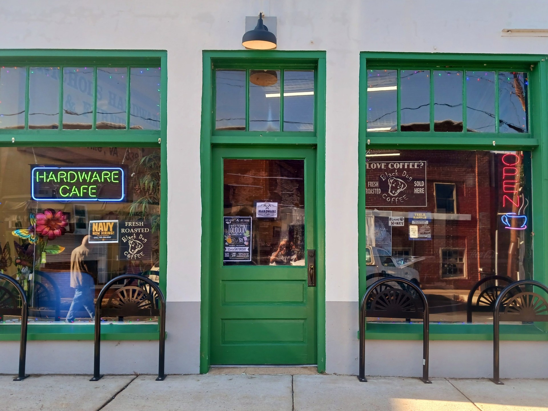 The Hardware Cafe green storefront with neon sign